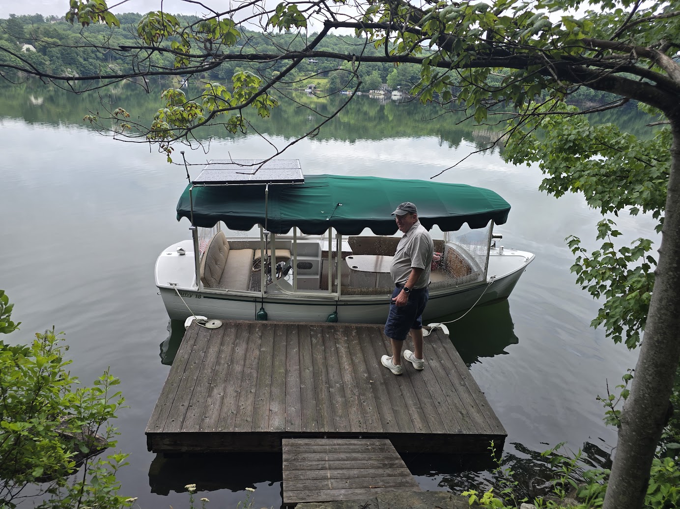 Electric Duffy boat with solar panels mounted above the canopy